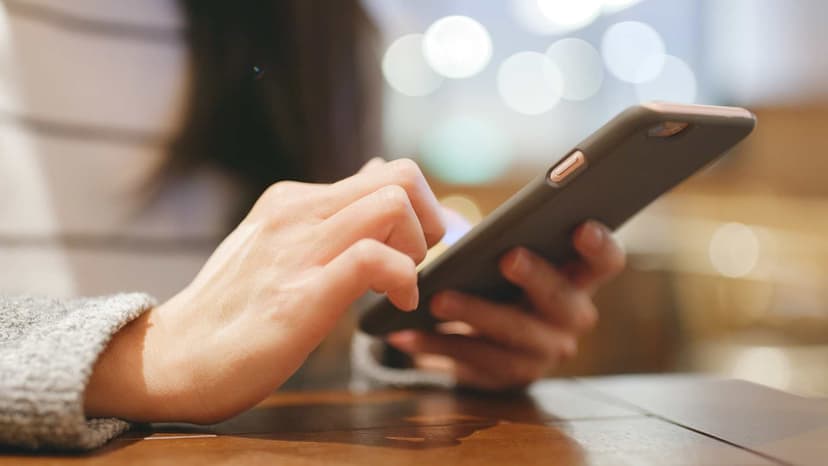 Hand tapping on surface of a smart phone