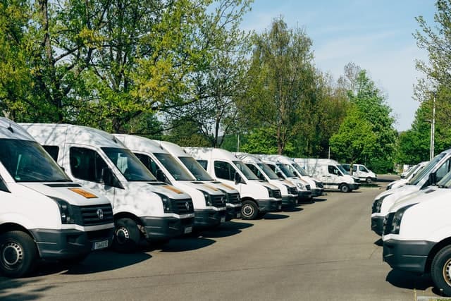 Cleaning service vehicles in a parking lot